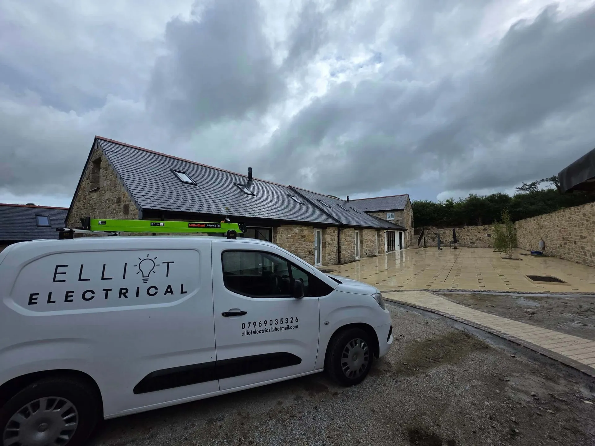 Elliot Electrical van parked outside a job